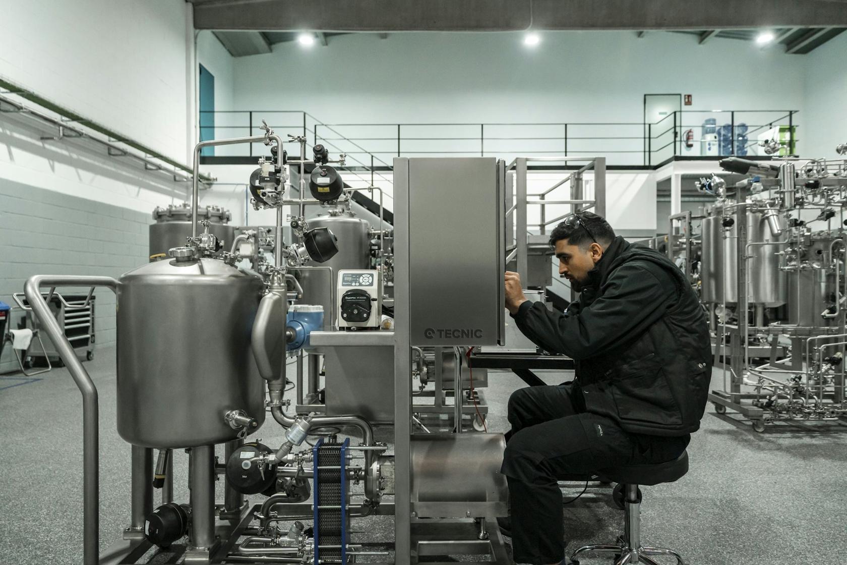 Engineer working on stainless steel process equipment