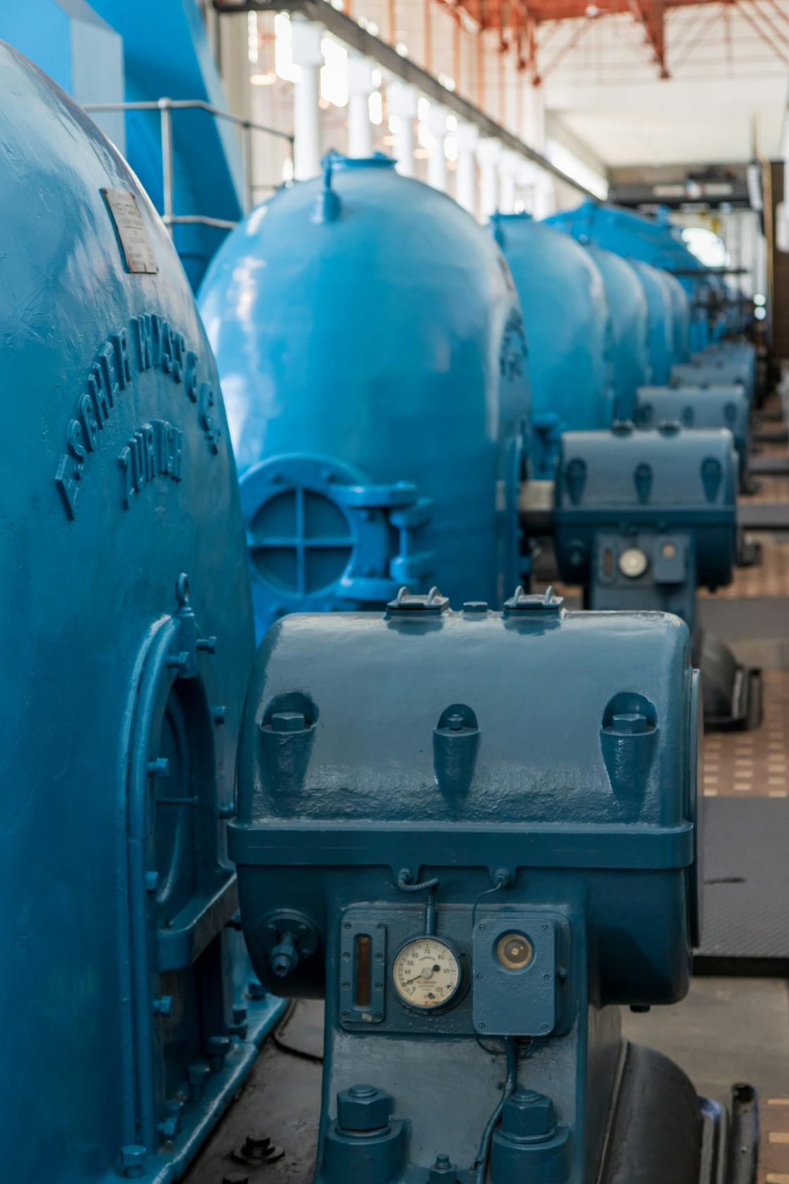 Row of industrial equipment in a manufacturing hall